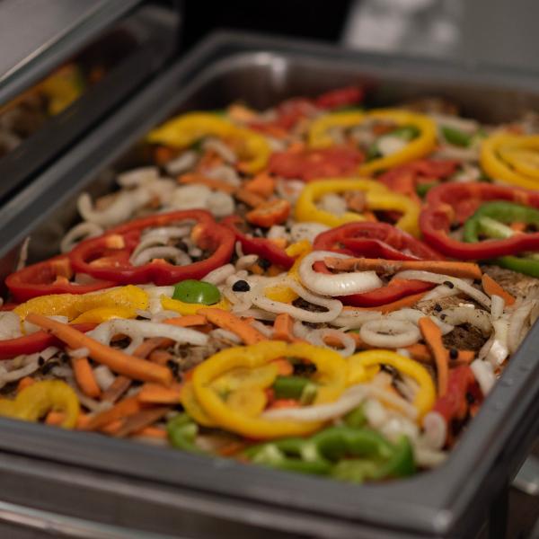 Close up image of tray of vegetables including peppers and carrots